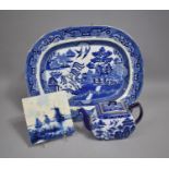 A Blue and White Willow Pattern Meat Plate, Delft Tile and a Willow Pattern Teapot