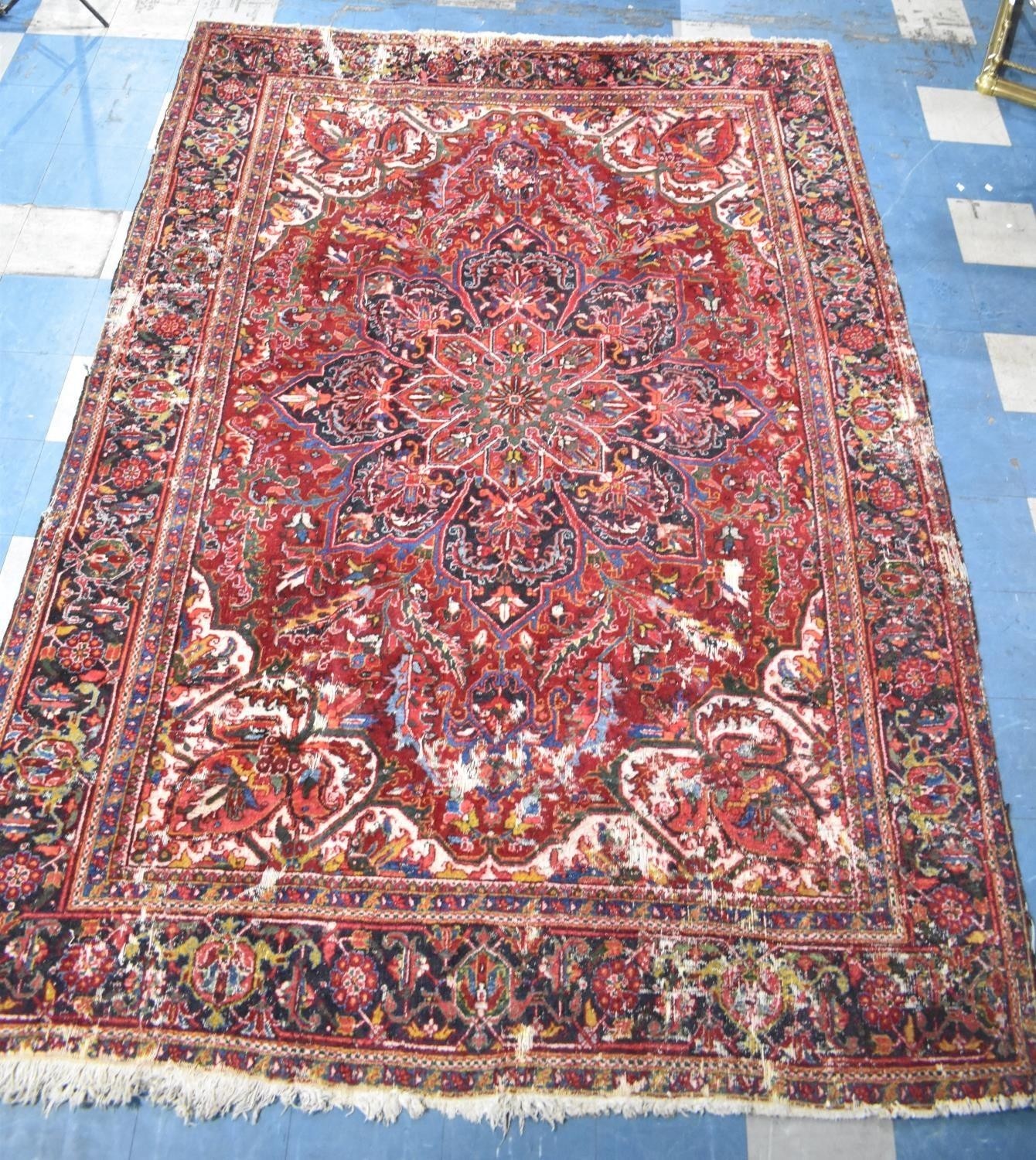 A Large Antique Persian Heriz Rug on Red Ground, Some Wear and Condition Issues, 340x240cms