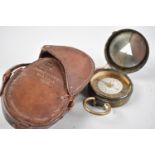 A WWI Period Leather Cased Brass Prismatic Compass by S Mordan and Co, Stamped with Crow's foot