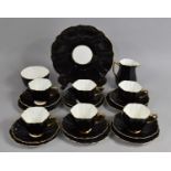 An Old Royal Black and Gilt Trim decorated Tea Set of Reeded Form to comprise Six Cups, Five Side