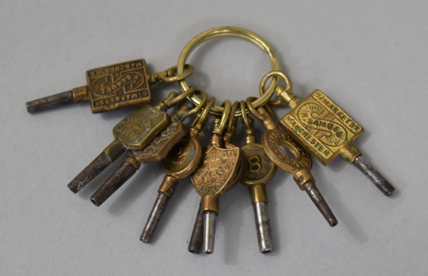 A Collection of Nine Trade Pocket Watch Keys, Makers to Include Samuel of Manchester, Tho.