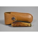 A Vintage Folding Pocket Knife, Blade Inscribed Made in Sheffield, Real Lambsfoot, Leather Pouch (