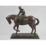 A Bronzed Effect Resin Study of an American Racehorse with Jockey Up, 29cms Wide