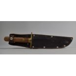 A Vintage Bowie Knife by William Rodgers, Brass Guard and Wooden Scales, Leather Sheath