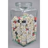 A Glass Jar Containing Large Quantity of Dice