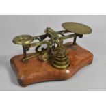 A Late Victorian Brass Postage Scale on Serpentine Shaped Plinth Base with Set of Graduated Weights,