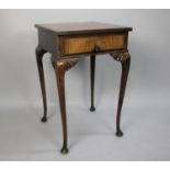 An Edwardian Walnut and Rosewood Crossbanded Side Table with Drawer on Extended Cabriole Supports,