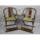 A Pair of Chinese Hardwood Horseshoe-back Folding Chairs, Having Brass Mounts and Carved Front