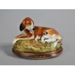 A Halcyon Days Enamel Bonbonniere, Modelled as a Hound and Pup, 8cm long