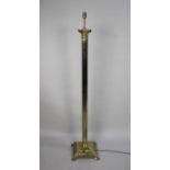 A Mid 20th Century Brass Standard Lamp in the Form of a Reeded Corinthian Column on Stepped Square