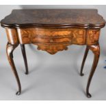 An 19th Century Dutch Marquetry Games Table with Single Drawer Under Flip Top Revealing Beize