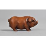 A Carved Wooden Netsuke in the Form of a Standing Boar, Signed, 5.5cm long