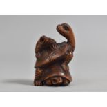 A Carved Wooden Netsuke in the form of Three Tortoises, Signed, 5cm high