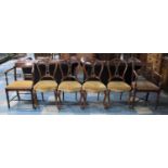 A Set of Four Carved and Pierced Victorian Carved and Pierced Victorian Balloon Back Chairs Together