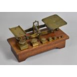 A Late Victorian Set of Brass Postage Scales with Graduated Weights Set on Mahogany Plinth Base,