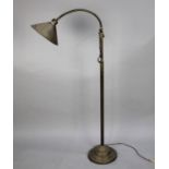 A Vintage Brass Adjustable Reading Lamp with Rise and Fall Mechanism