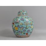 A Large 20th Century Chinese Ginger Jar and Cover Decorated in the Famille Rose Palette on Blue