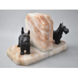 A Pair of Novelty Bookends in the Form of Cold Painted Scottie Dogs on Veined Onyx Marble Stands,