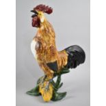 A Continental Majolica Glazed Study of Cockerel Perched on Sweetcorn, 33cms High