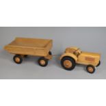 A Modern East German Wooden Toy Tractor and Trailer Set