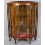 A Mid 20th Century Bow Fronted Walnut Display Cabinet with Galleried Back, 89cm wide