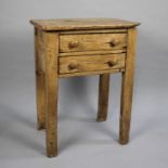 A Stripped Pine Side Table with Two Drawers, 55cms Wide