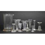 A Collection of Various Early 19th Century Glass Pharmaceutical Items to Include Measures, large