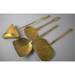 A Collection of Three Victorian Brass Skimmers and a Victorian Brass Triangular Chestnut Roaster