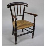 A Late Victorian Rush Seated Child's Armchair with Spindled Back
