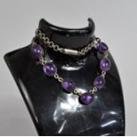 A Vintage White Metal Necklace with Seven Oval Amethyst Stones