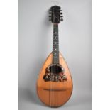 A Mother of Pearl and Tortoiseshell Mounted Eight String Mandolin