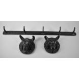 A Pair of Cast Metal Bull Mounts together with a Five Hook wall Mounting Coat Rack, 74cms Long