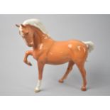 A Beswick Palomino Horse (head tucked, leg up), 1st Version, 1549