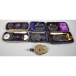A Collection of Three Cased and One Loose Ophthalmoscopes