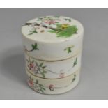 A Chinese Porcelain Famille Rose Three Tier Box, the Lid Decorated with Bird in Blossoming Branches