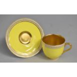 A Royal Worcester for Harrods Yellow and Gilt Cup and Saucer decorated with Jewelled Trim