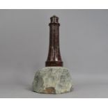 A Novelty Table Lamp Base in the Form of a Serpentine Marble Lighthouse Set on Rock Plinth, 35cms