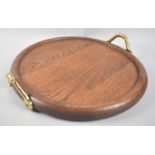 A Modern Circular Oak Tray with Brass Carrying Handles, 32cms Diameter