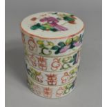 A Chinese Porcelain Famille Rose Four Tier Box, the Lid Decorated with Figures in Garden Setting