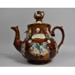 A Late 19th Century Large Measham Bargeware Treacle Glazed Teapot inscribed 'A Present From a