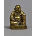 A Small Chinese Polished Bronze Travelling Buddha, 5cm high