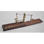 A 19th Century Mahogany Cased Guinea and Sovereign Scale with Five Graduated Weights