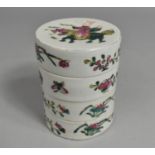 A Chinese Porcelain Famille Rose Four Tier Box, the Lid Decorated with Figures on Horse