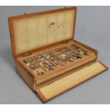 A Box Containing Six Trays of Miniature Enamelled City Shield Charms, All But One Full, 20.5cms Wide