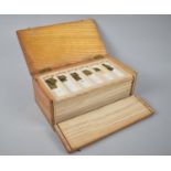 An Early/ Mid 20th century Box Containing Eleven Trays of Gram Weights, Apothecary Weights Etc, 21.