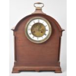 An Edwardian Arched Top Mahogany Cased Mantel Clock with Brass Carrying Handle and Turned Pilaster
