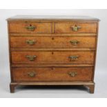 A 19th Century Oak Crossbanded Chest of Two Short and Three Graduated Long Drawers, Bracket Feet, in