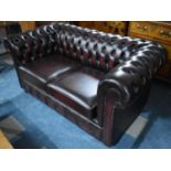 A Modern Button Upholstered Leather Effect Two Seater Chesterfield Settee, 155cms Wide