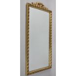 A Gilt Framed Wall Mirror with Bow Ribbon Finial, 70x35cm