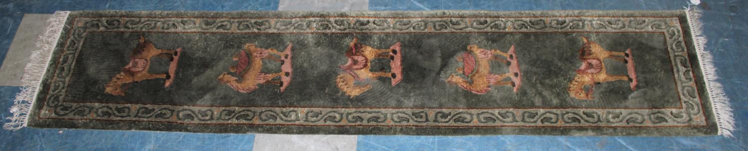 A Narrow Patterned Runner Decorated with Camels and Horses, 208x47cms